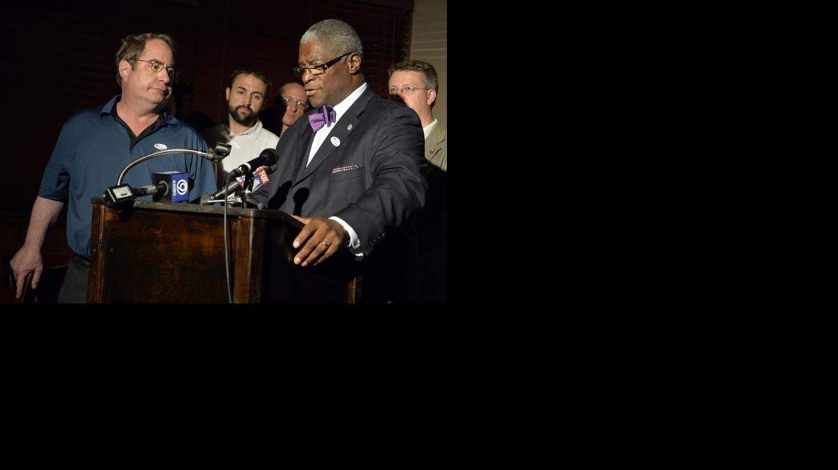 
Connect-KC and supporters of Question A, which would have created a transportation development district in Kansas City, gathered Tuesday to watch election returns. Councilman Jim Glover (left) listened as Mayor Sly James addressed the crowd after voters rejected the proposal.
