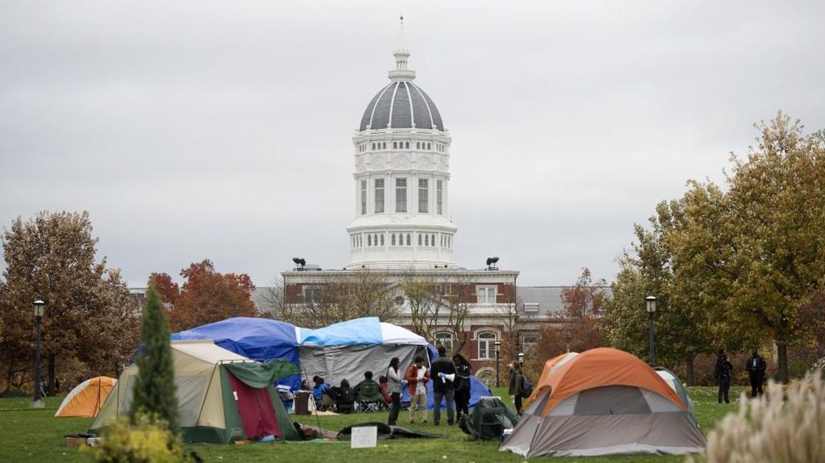University of Missouri System president Tim Wolfe apologized Friday for not responding to protests, which have included students camping out at Traditions Plaza on the Columbia campus.