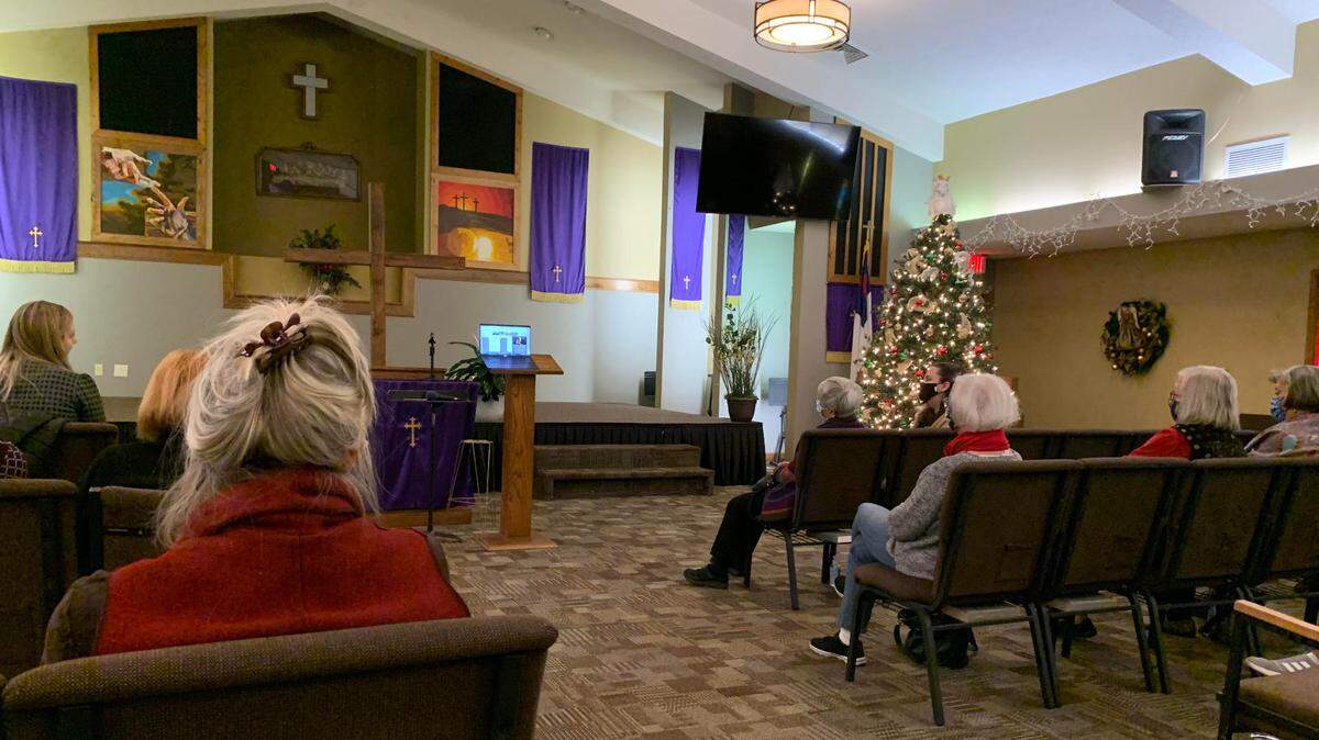 Participants at a Kansas redistricting town hall site in Stilwell on Tuesday. A single laptop was set up at the site for members of the public to watch and deliver testimony at the session, which was held virtually.