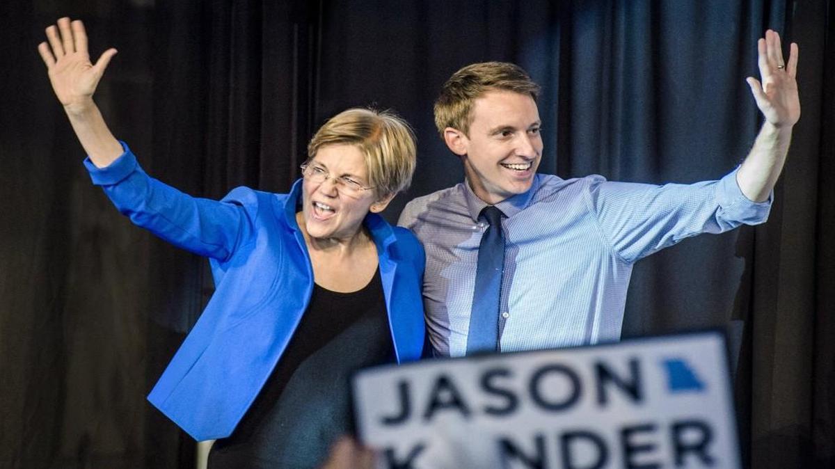 U.S. Sen. Elizabeth Warren and Democratic Senate candidate Jason Kander waved to more than 1,000 people Friday during a campaign event for Kander at the College Basketball Experience in downtown Kansas City. Kander is in a tight race with Republican incumbent Sen. Roy Blunt.