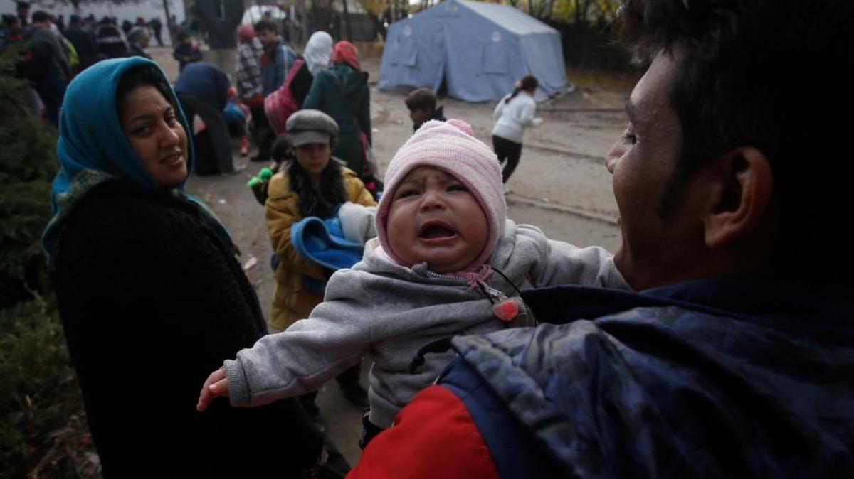 Migrants waited to register with the police Monday at a refugee center in the southern Serbian town of Presevo.