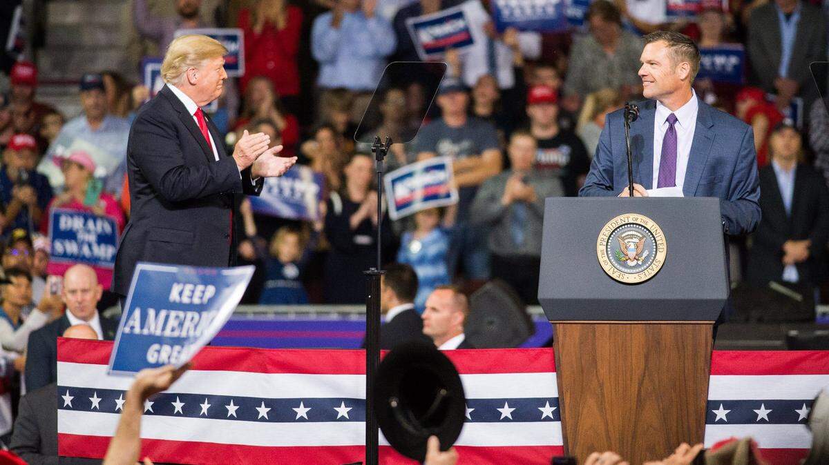 Kris Kobach appeared with former President Donald Trump during a 2018 rally in Topeka.