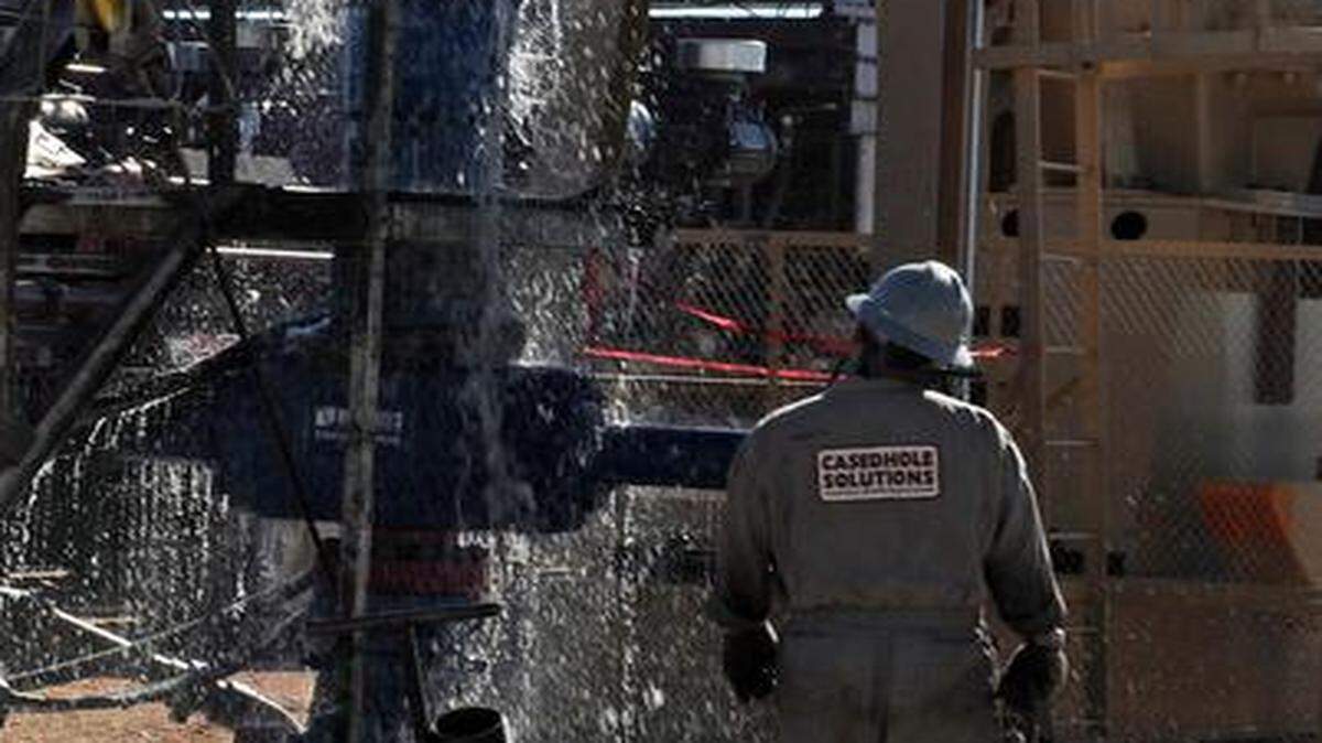 
Water gushes out of a drilling pipe as it is pulled up to be replaced with a fresh pipe at a hydraulic fracturing site in Midland, Texas. The drilling method known as fracking uses huge amounts of high-pressure, chemical-laced water to free oil and natural gas trapped deep in underground rocks. Some have speculated the process is related to earthquake frequency.
