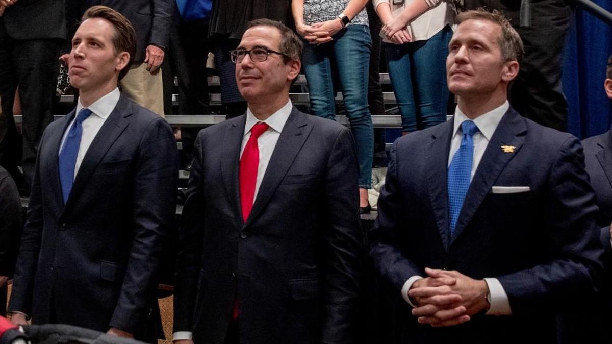 Revelations by The Star that Gov. Eric Greitens (right) uses an app that deletes text messages after they’ve been read outraged Missouri Democrats, who are calling on Attorney General Josh Hawley (left) to open a formal investigation of the governor’s office. In this Nov. 29 photo, Hawley and Greitens flanked U.S. Treasury Secretary Steve Mnuchin as President Donald Trump spoke at a tax reform rally in St. Charles, Mo.