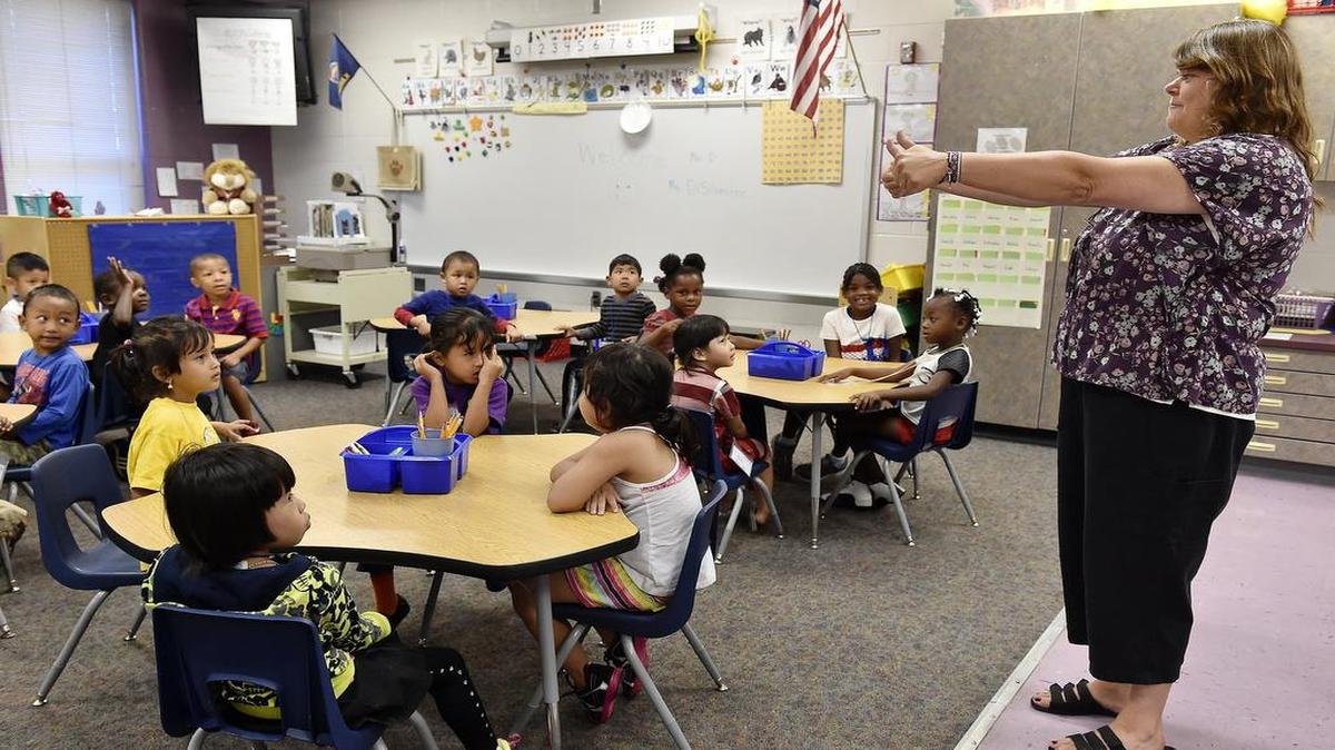 At New Chelsea Elementary School in Kansas City, Kan., last August, kindergarten teacher Ruth DiSilvestro gave students a thumbs up.