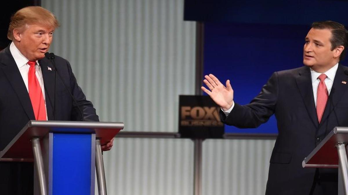 Donald Trump (left) and Ted Cruzs talk over each other during Thursday’s Fox Business Network Republican presidential debate in North Charleston, S.C.