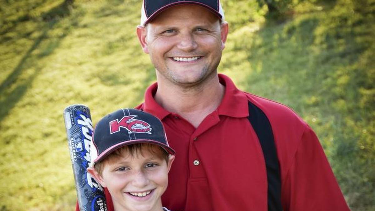 This June 2016 photo shows Caleb Thomas Schwab posing with his father Scott Schwab, a Kansas state lawmaker from Olathe. Caleb died Aug. 7 while riding the Verrückt water slide in Kansas City, Kan.