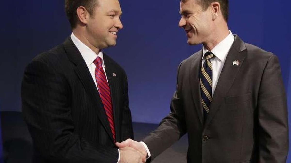 Rep. Marlin Stutzman, left, and GOP Senate rival Rep. Todd Young, right
