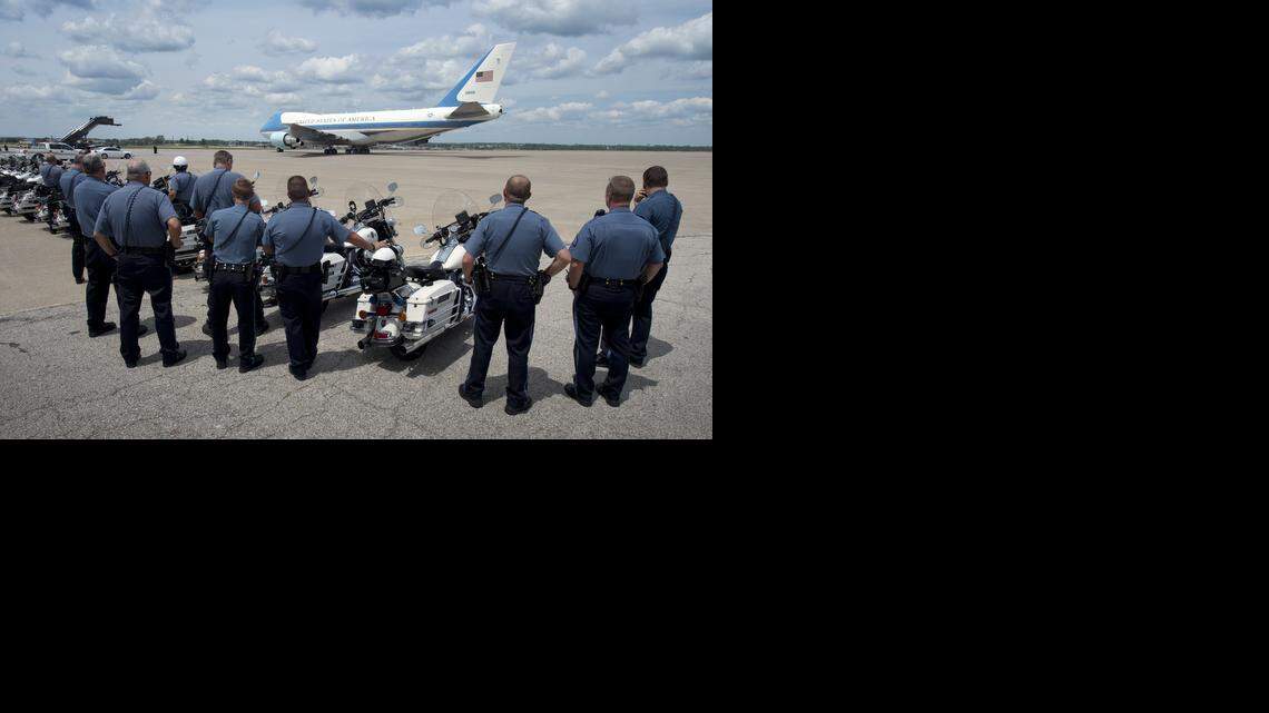 
Kansas City motorcycle officers watched as Air Force One carrying President Barack Obama taxied towards the runway on Wednesday, July 30, 2014, in Kansas City.
