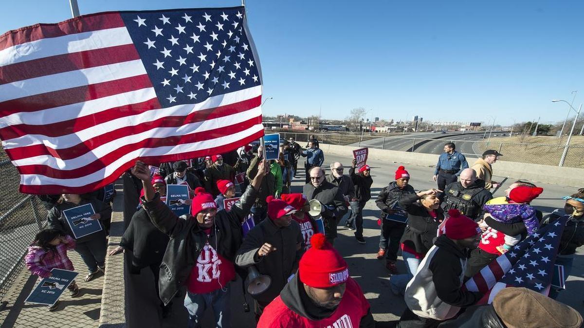 
A group of protesters marched across the Prospect Bridge at Interstate 70 on March 7 to call for unionization and higher minimum wages for fast-food workers.

