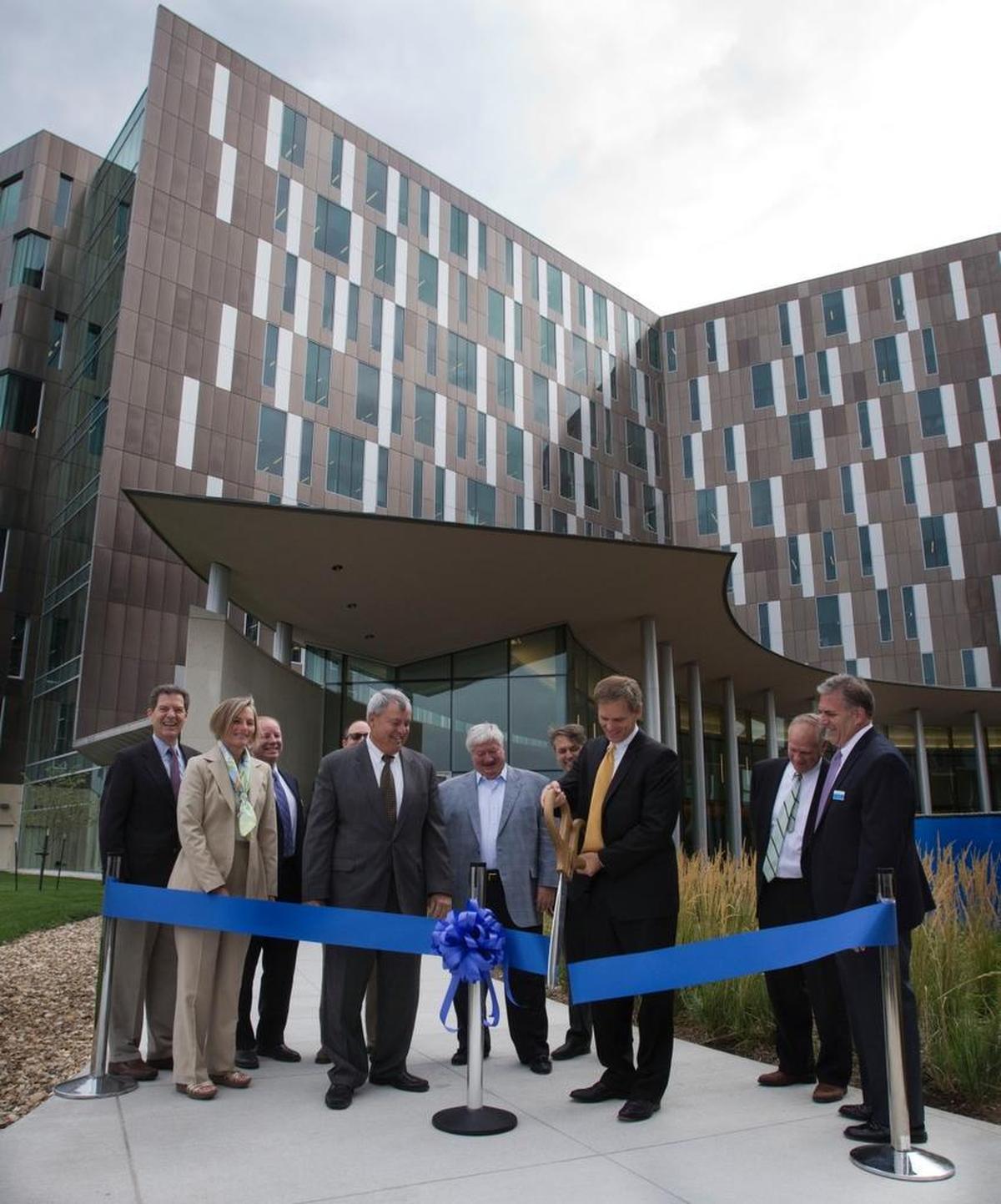 State and local dignitaries, including Gov. Sam Brownback (far left), joined Cerner officials in cutting the ribbon to officially open the first of two buildings at the new Cerner office complex in 2013 in Kansas City, Kan. Cerner gets tax credits in both Missouri and Kansas. Missouri has made those records public. In Kansas, however, the information is deemed secret.
