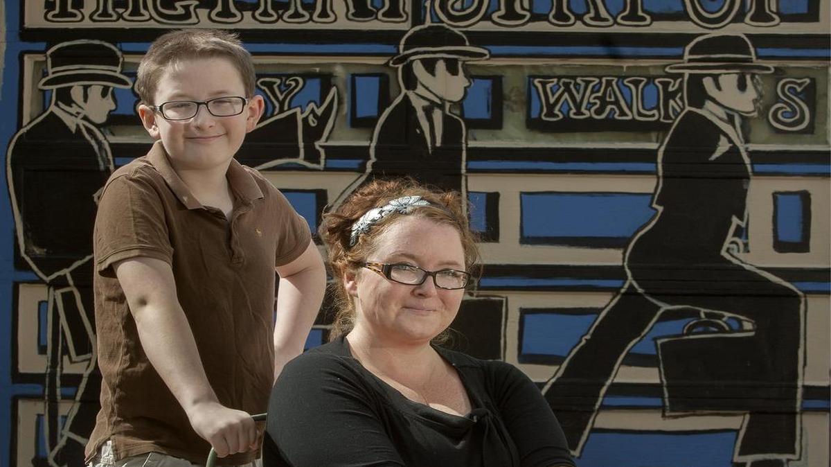 
Bianca McCollough, received a letter from the city of Olathe to remove a mural she calls “Ode to Monty Python” that she and son Donovan Stricklin painted on her garage door. 
