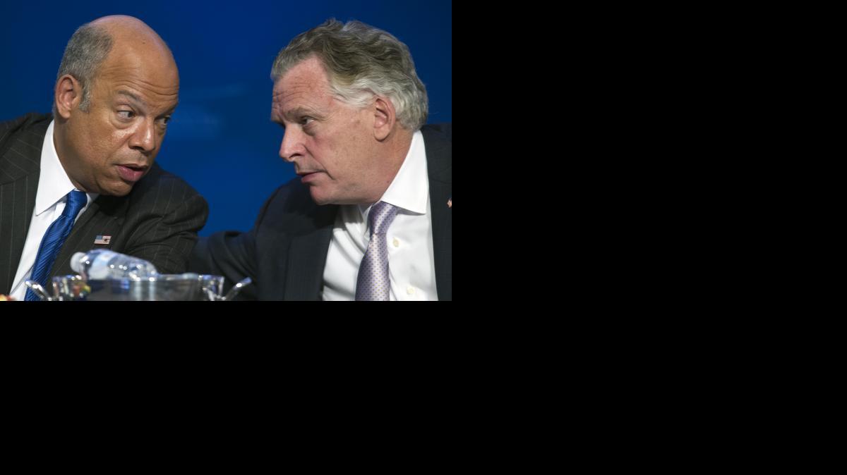 
Department of Homeland Security Secretary Jeh Johnson speaks with Homeland Security and Public Safety Committee Vice Chair Virginia Gov. Terry McAuliffe 
