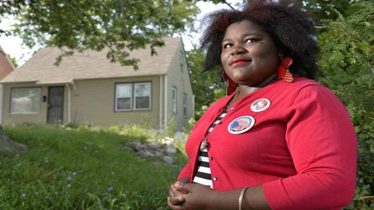 
Cecilia S. Johnson founded the group Hood Conservatives for conservatives like herself who live in the city’s core neighborhoods. Johnson stands in front of her east Kansas City home.
