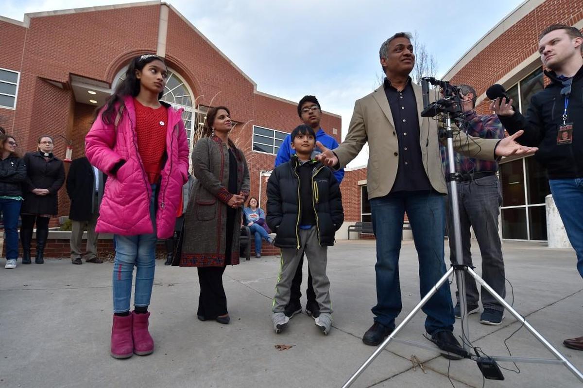 Syed Hussain Jamal (second from right) talked about the return of his brother, Syed Ahmed Jamal, outside the Platte county detention center in Platte City. He’s surrounded by his brother’s children.