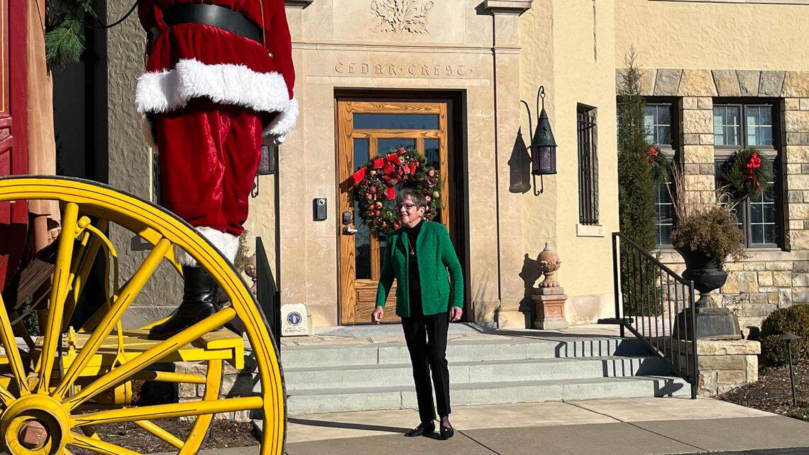 Kansas Gov. Laura Kelly watches as Santa delivers a Christmas tree to Cedar Crest, the governor’s residence. Kelly refused to answer questions at the event about her decision to sign a Republican-backed bill on COVID-19 vaccine mandates.