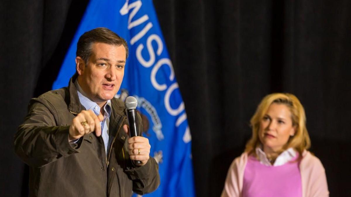 Republican presidential candidate Sen. Ted Cruz, R-Texas, speaks at a campaign stop as wife Heidi listens Thursday,