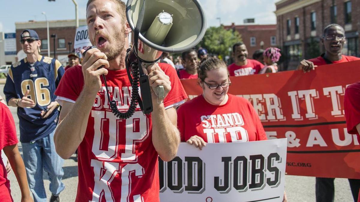 
Daniel Tucker of Kansas City used a bullhorn during a Sept. 10 march to the Kansas City Restaurant Association offices in Westport. Members of the Stand Up KC organization urged a $15 an hour minimum wage for low-wage workers. 


