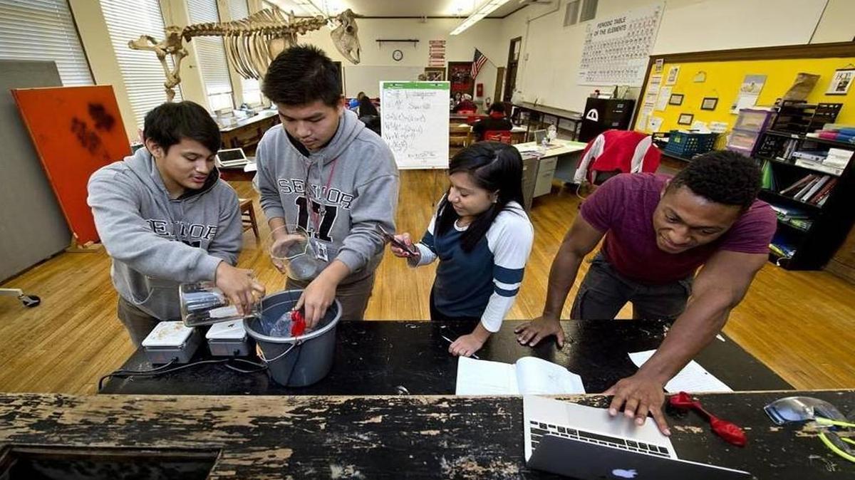 Isidro Torres (from left), Jonathan Sang, Adriana Sabado and Yaseen Chapell worked on a physics experiment in December at Wyandotte High School in Kansas City, Kan.