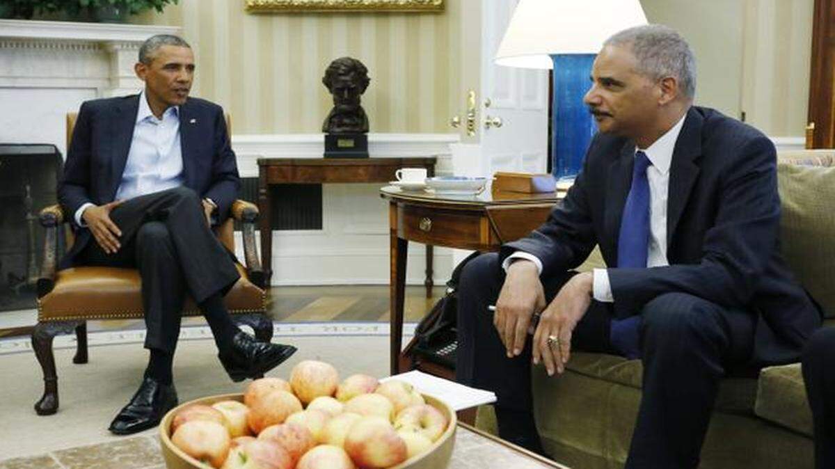 
Attorney General Eric Holder is resigning after serving as head of the Justice Department for six years. In August, he spoke with President Barack Obama about the fatal police shooting of Michael Brown in Ferguson, Mo., in the Oval Office at the White House in Washington. 
