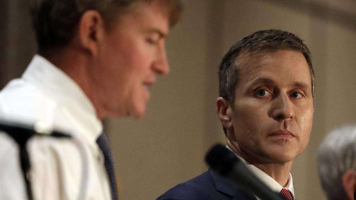 Republican gubernatorial candidate Eric Greitens, right, listens along side Democratic challenger Chris Koster during the first general election debate in the race for Missouri governor at the Missouri Press Association convention Friday, Sept. 30, 2016, in Branson, Mo.