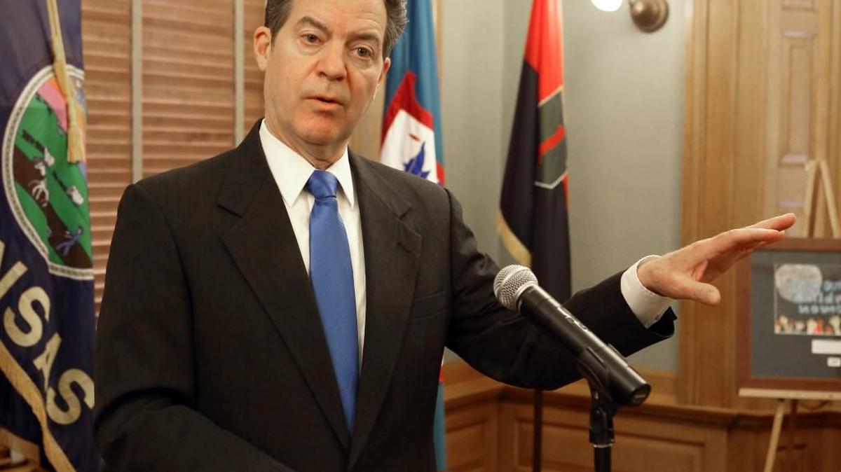 After signing several bills, Gov. Sam Brownback talks about a variety of things including Donald Trump and Hillary Clinton during a news conference Wednesday.