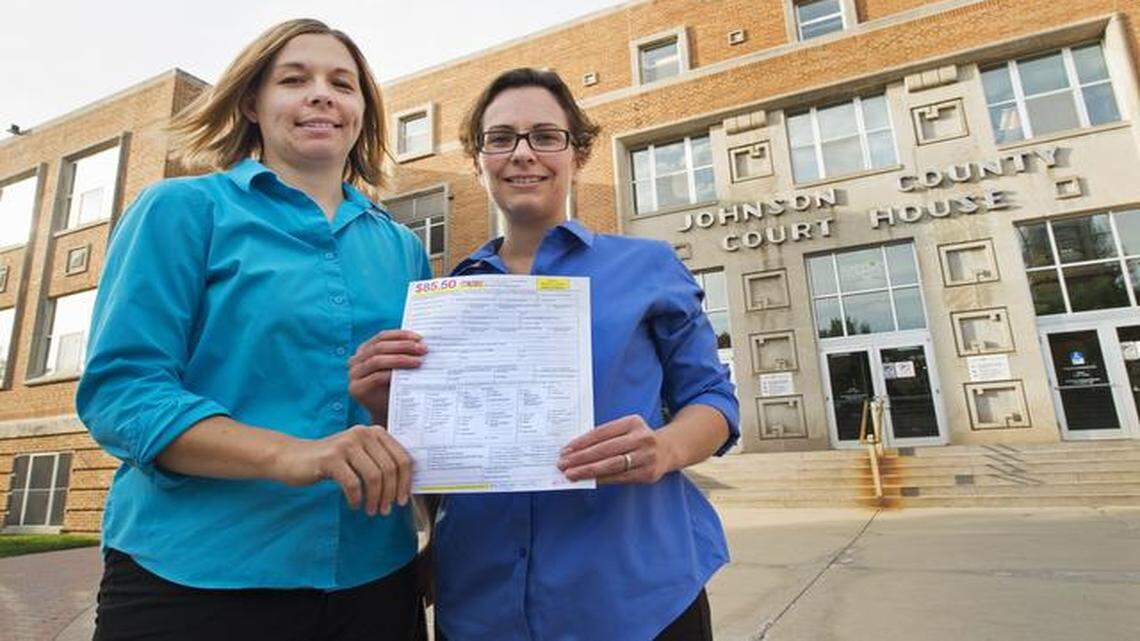 
On Oct. 8, Angela Schaefer (left), 31, and longtime partner Jennifer Schaefer, 28, got an application for a marriage license at the office of the county clerk in the Johnson County Courthouse in Olathe. They did so after Chief District Judge Kevin Moriarty directed the clerk to issue marriage licenses to same-sex couples without fear of being prosecuted under Kansas law. On Tuesday, the Kansas Supreme Court lifted its stay of Moriarty’s order, allowing same-sex marriages to proceed in the county.
