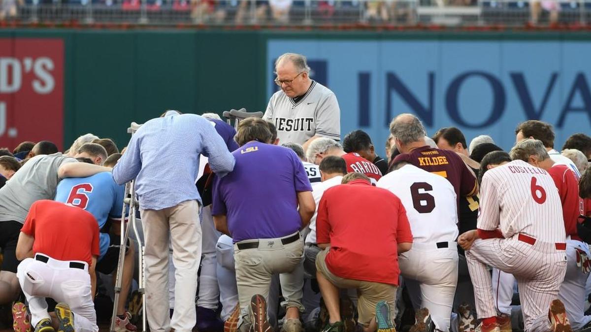 The House chaplain led Democrats and Republicans in prayer before the Congressional Baseball Game earlier this month at Nationals Park in Washington, D.C.