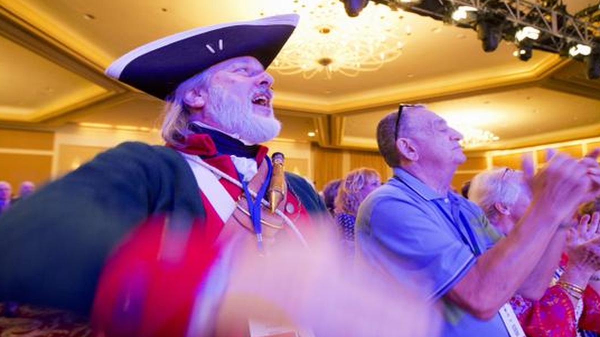 
Summit attendee William Temple, from Brunswick, Ga., left, and others, cheer during the 2014 Values Voter Summit in Washington, Friday, Sept. 26, 2014. 
