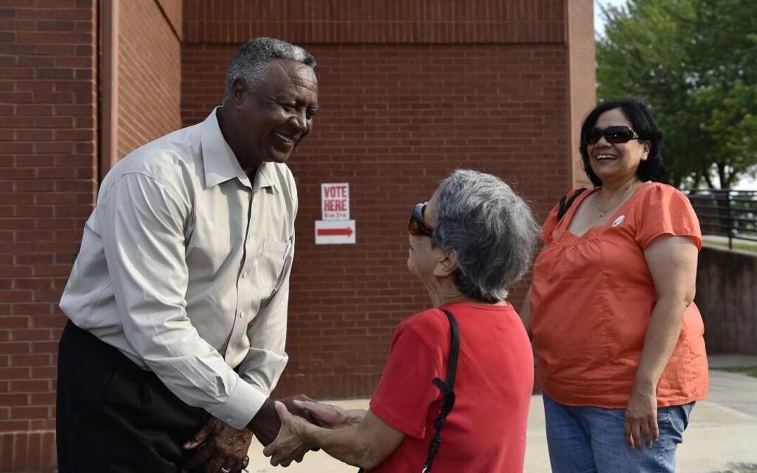 Frank White greeted voters outside polling stations in Kansas City in 2014 when he was running for the Jackson County Legislature. He now may be in line to serve this year as interim county executive.