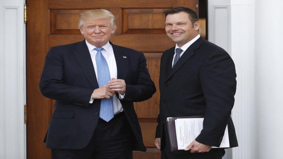 Kansas Secretary of State Kris Kobach held a stack of papers as he met in November with then President-elect Donald Trump at the Trump National Golf Club Bedminster clubhouse in Bedminster, N.J.