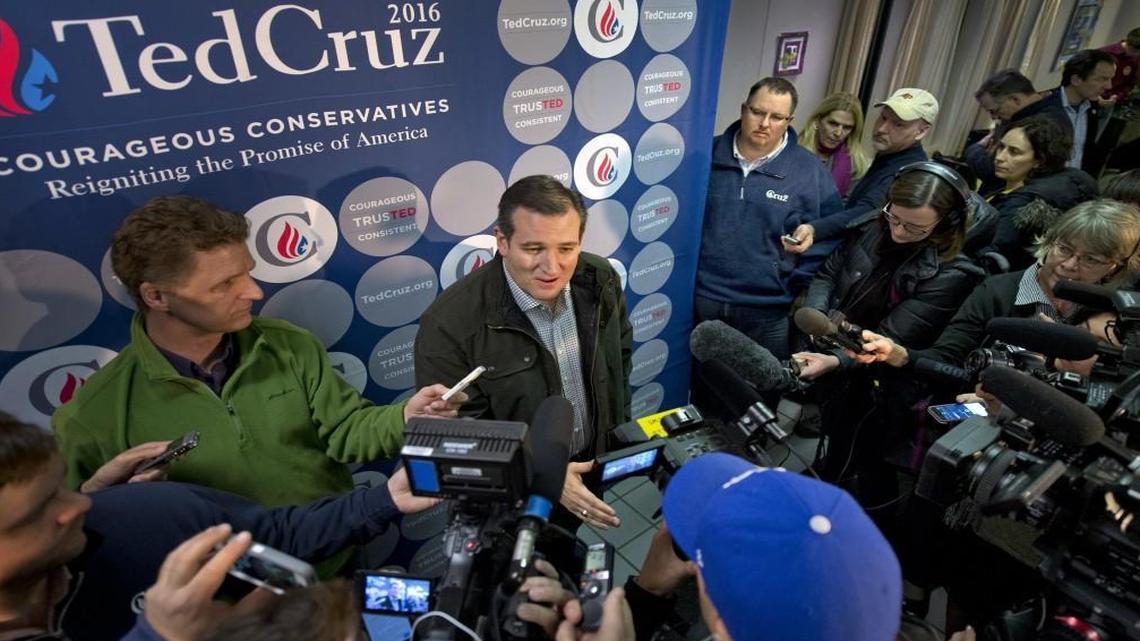 GOP political consultant Jeff Roe (upper right wearing Cruz pullover) watched as Ted Cruz talked with the media Jan. 4 in Winterset, Iowa. Roe is running the Cruz campaign in Iowa.