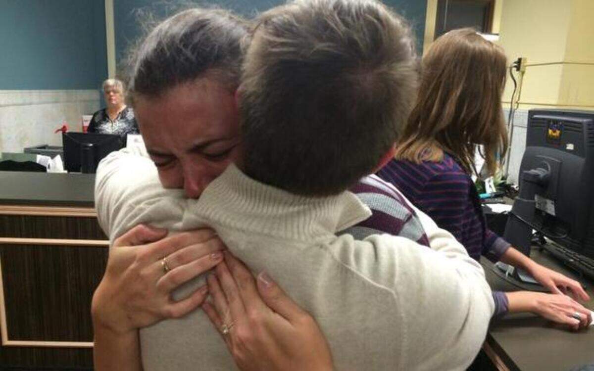 
In this photo provided by Michael Calhoun and KMOX Radio, Lilly Leyh (left) cried as she hugged her partner, Sadie Pierce, while filling out an application for a marriage license Wednesday at City Hall in St. Louis. Earlier in the day, a state judge overturned Missouri’s constitutional ban on gay marriage, a ruling that immediately set off a rush among some same-sex couples to apply for marriage licenses.
