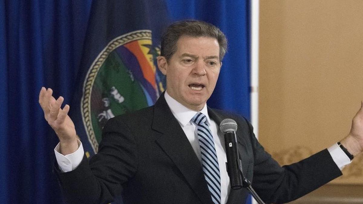 Kansas Gov. Sam Brownback said Wednesday he would not veto a bill establishing a flat tax rate or getting rid of the LLC business tax exemption.