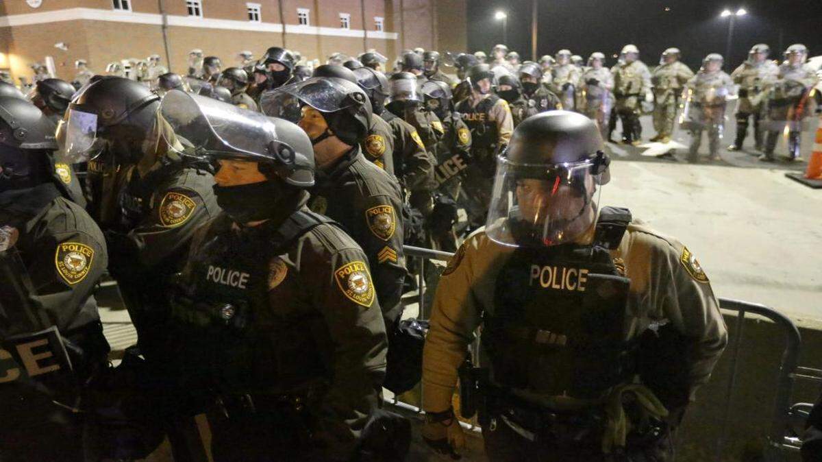 
Police lined up in front of the Ferguson Police Department on Nov. 25, 2014, after protests and rioting. The Ferguson case spurred a push nationwide for police to use body cameras.
