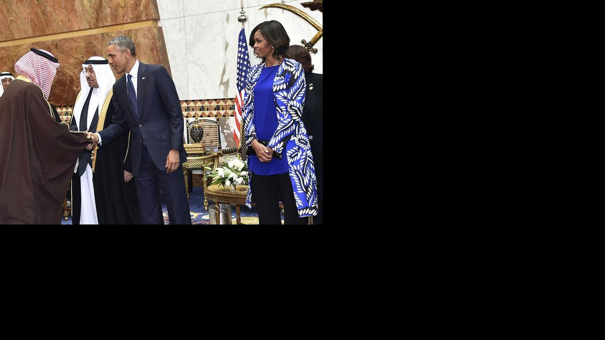 
President Barack Obama and first lady Michelle Obama stand in a receiving line, in Riyadh, Saudi Arabia, Tuesday
