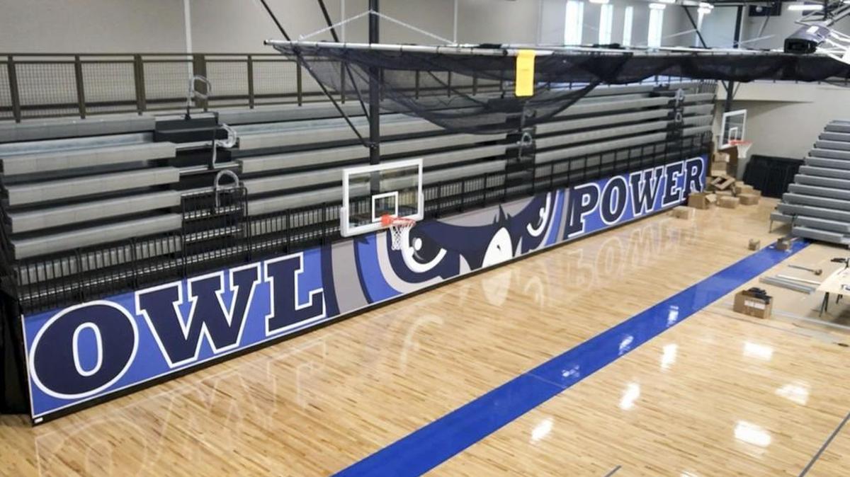 The Olathe City Council touted a mill-levy reduction in August, but a misunderstanding that left Olathe West High School — shown here getting a fresh coat of paint in the gym Thursday, Aug. 3, 2017, before opening its doors to students for the first time — on property tax rolls when budgets were set might mean that taxpayer savings vanishes.