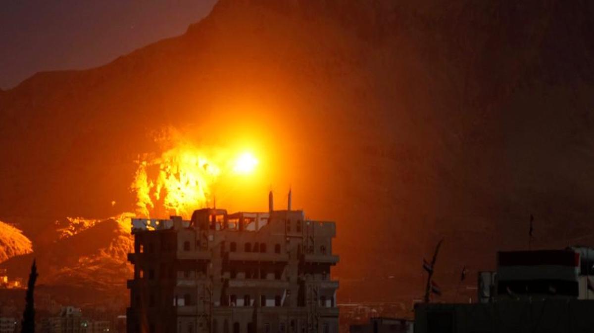 In this Sept. 24 photo, an explosion is seen following a Saudi-led airstrike at a site believed to be one of the largest weapons depots in Sanaa, Yemen. The war in Yemen, which escalated in March, may be one of the overlooked international stories of the year.