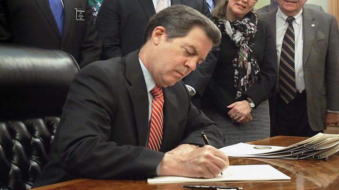 
Gov. Sam Brownback signed legislation Thursday adding Kansas to the short list of states allowing unlicensed possession of concealed firearms and eliminating a weapons training mandate for people to carry hidden guns. 
