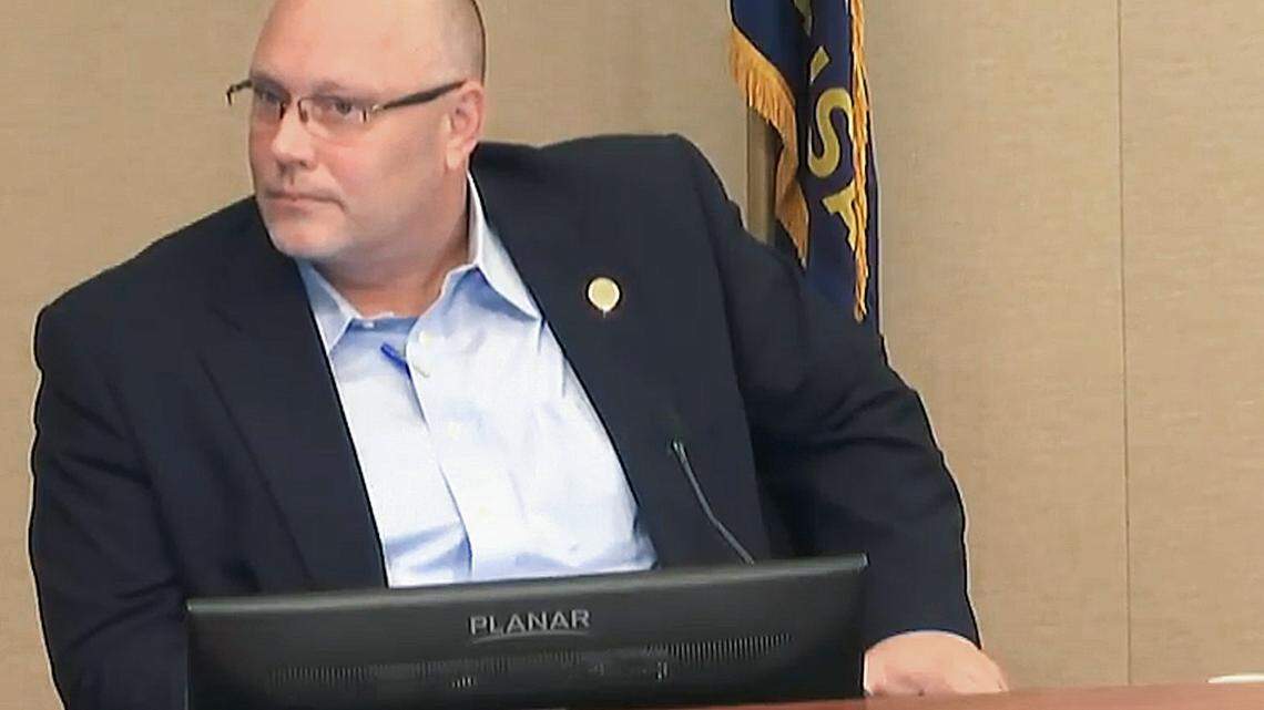 Johnson County Commissioner Mike Brown, shown during a 2018 Johnson County Commissioners meeting, brought partisan politics to the commission. On the commission, Brown became a pariah, opposing mask mandates and urging people to buy guns in anticipation of a coming war.