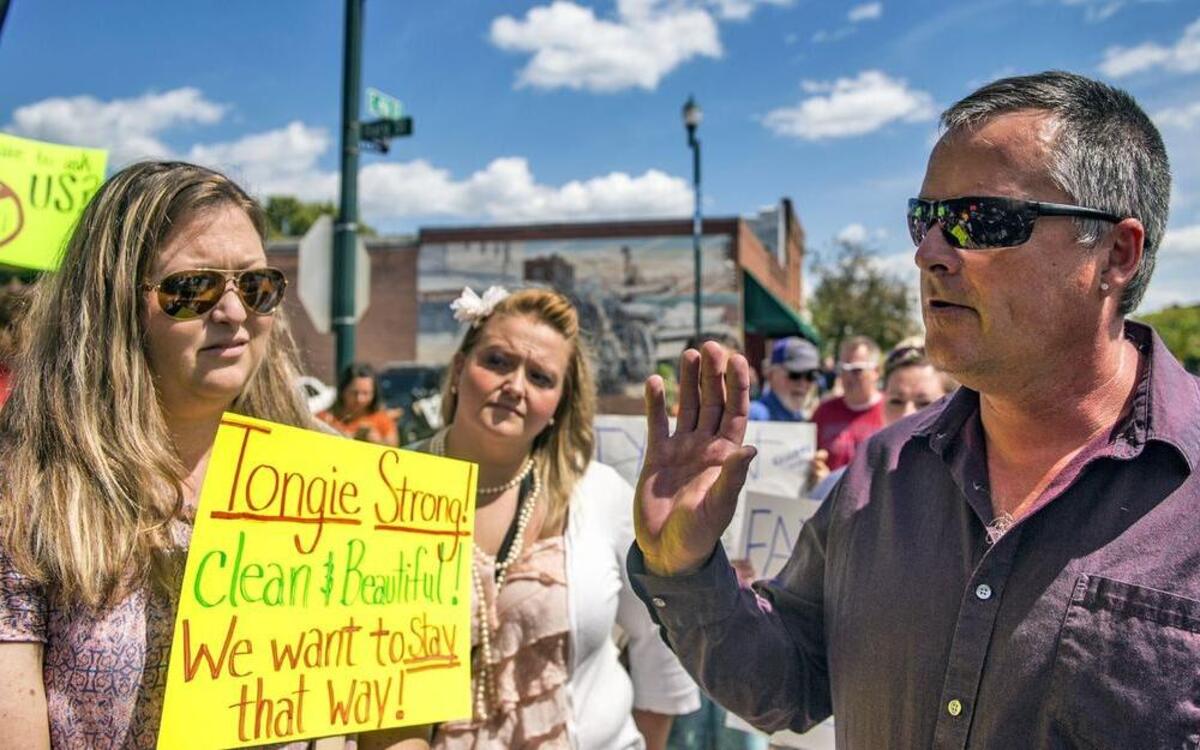 Tonganoxie City Council member Curtis Oroke talked to protesters after an announcement of a Tyson Foods chicken processing plant coming to the city.