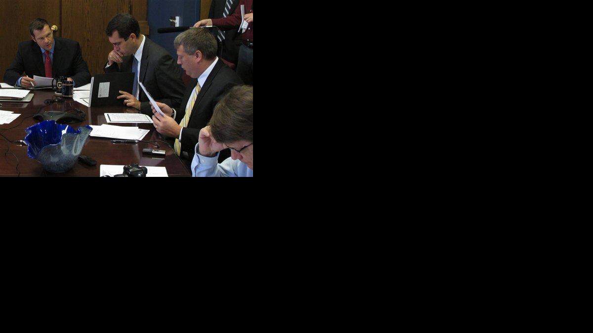 
Kansas Secretary of State Kris Kobach (left) discussed the case of a 92-year-old Shawnee woman who initially couldn't meet a proof of citizenship requirement because she doesn’t have a birth certificate during a meeting Wednesday of the State Election Board in Topeka. Listening to him were Attorney General Derek Schmidt (center) and Caleb Crook (right), an attorney in the secretary of state’s office.
