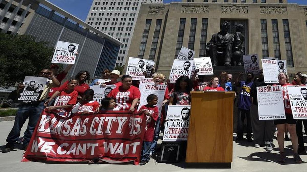 
About 40 people, including fast-food workers and local faith leaders, gathered over the lunch hour Friday on the south side of City Hall to urge the City Council to approve a minimum wage increase.

