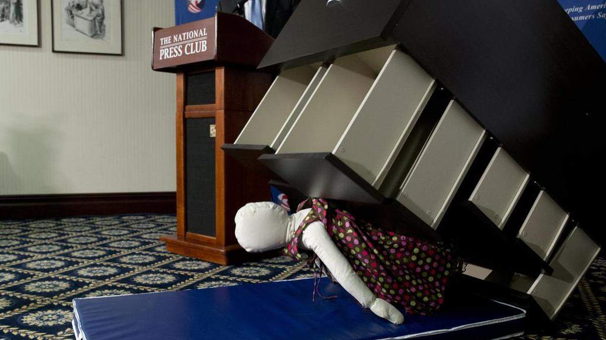Consumer Product Safety Commission Chairman Elliot Kaye watched a demonstration of how an Ikea dresser can tip and fall on a child as part of a news conference June 28 at the National Press Club in Washington. Under Kaye's leadership, the commission has dramatically increased the penalties imposed on wayward companies, including multimillion dollar-settlements with firms accused of failing to make timely disclosures of product hazards.