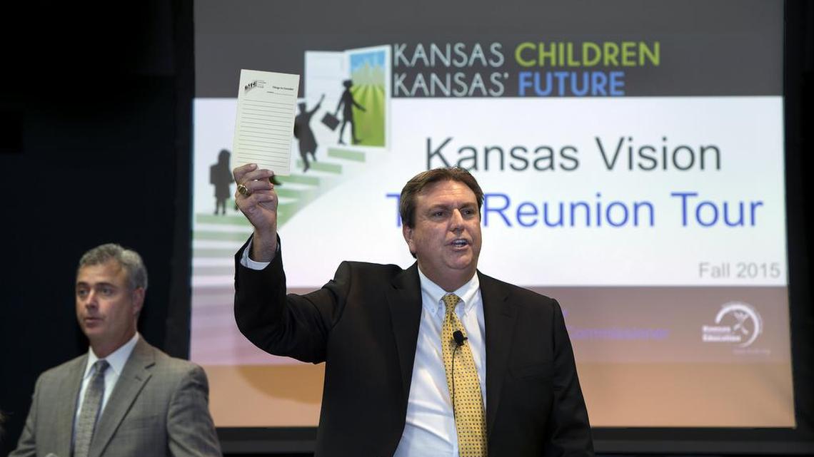 Kansas Education Commissioner Randy Watson, center, and Deputy Commissioner Brad Neuenwander, left, during a 2015 forum in Olathe.