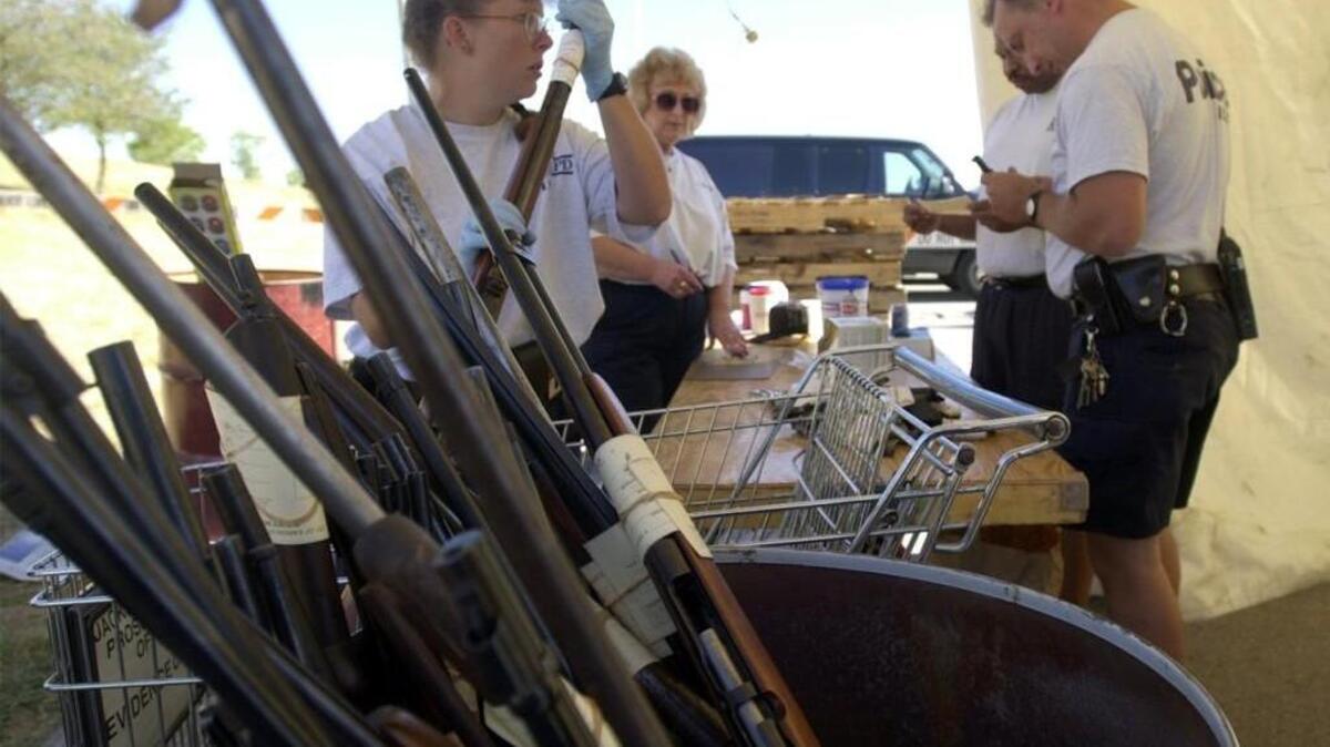 File photo. People dropped off guns in exchange for money at a September 2000 gun buyback program in Kansas City.