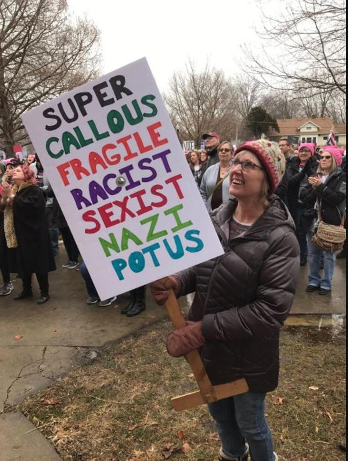 One of the signs seen at the Lawrence event on Saturday.
