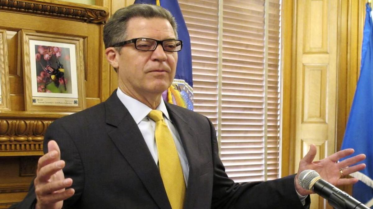 Kansas Gov. Sam Brownback spoke earlier this month after the Legislature overrode his veto of a bill increasing income taxes to fix the state budget.