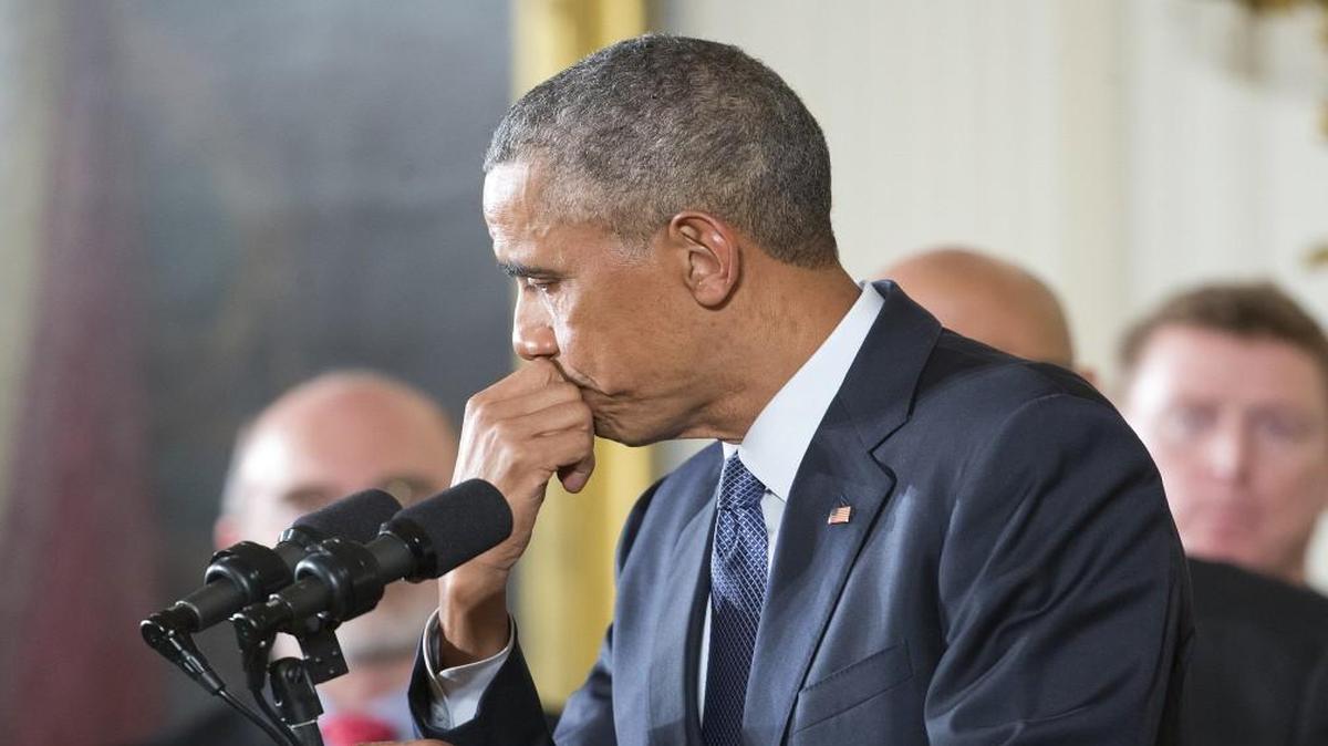 President Barack Obama paused Tuesday while speaking in the East Room of the White House about steps his administration is taking to reduce gun violence.