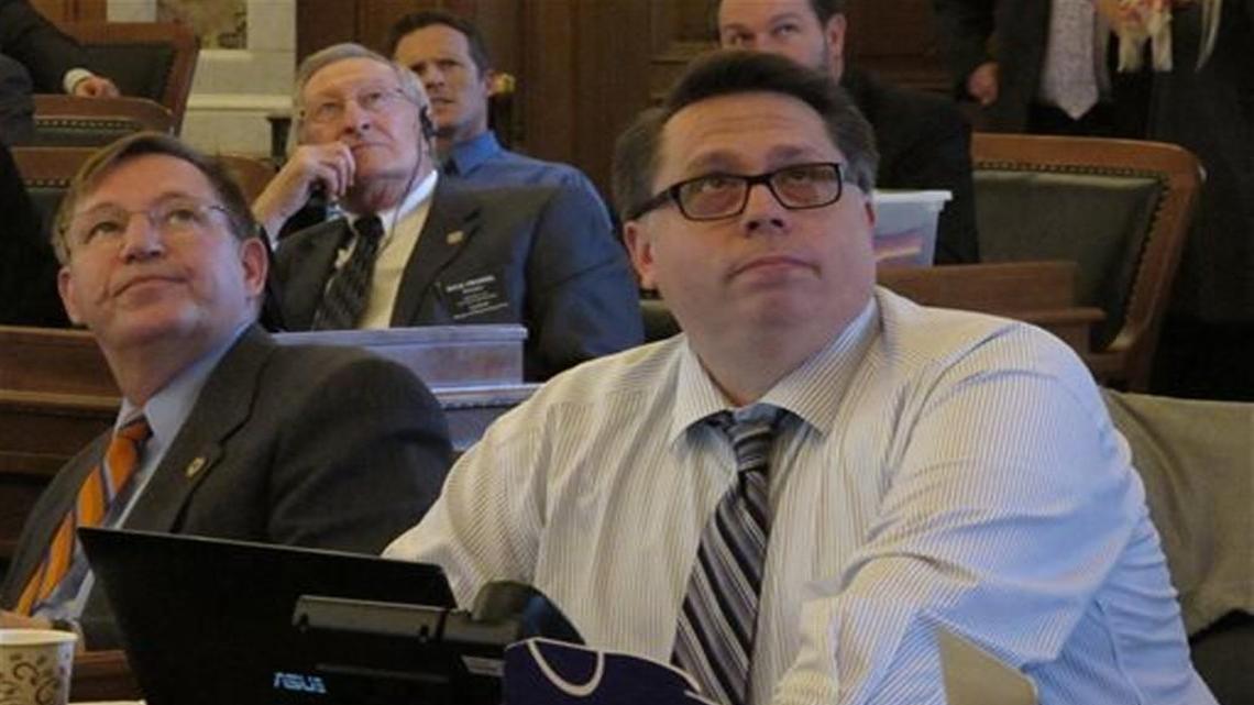 In March, Kansas state Rep. John Whitmer (right) watched an electronic tally board for a bill to block the state from using Common Core academic standards in its public schools.